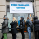People wait in line at Chef Jose Andres’ World Central Kitchen for free meals to workers effected by the government shutdown in Washington, Wednesday, Jan. 16, 2019.